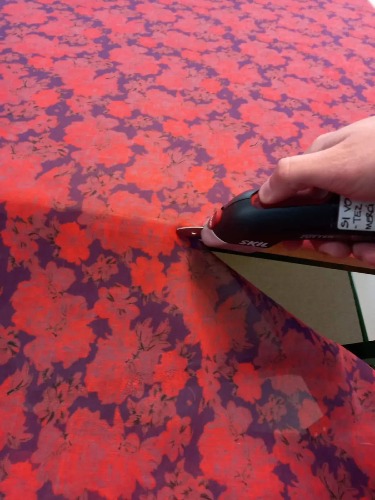Printed fabric being cut by hand in the Alsace microfactory